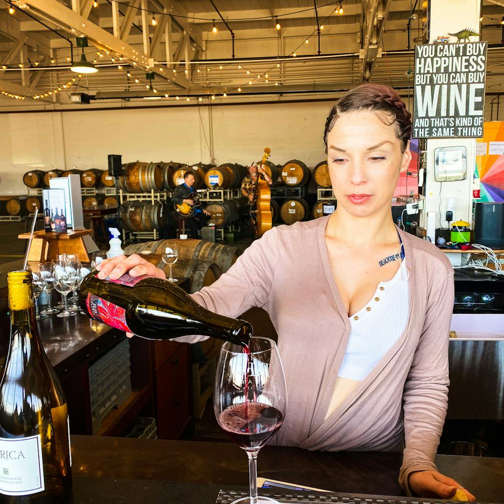 Woman pouring wine at Riggers Loft in the historic Richmond Shipyard