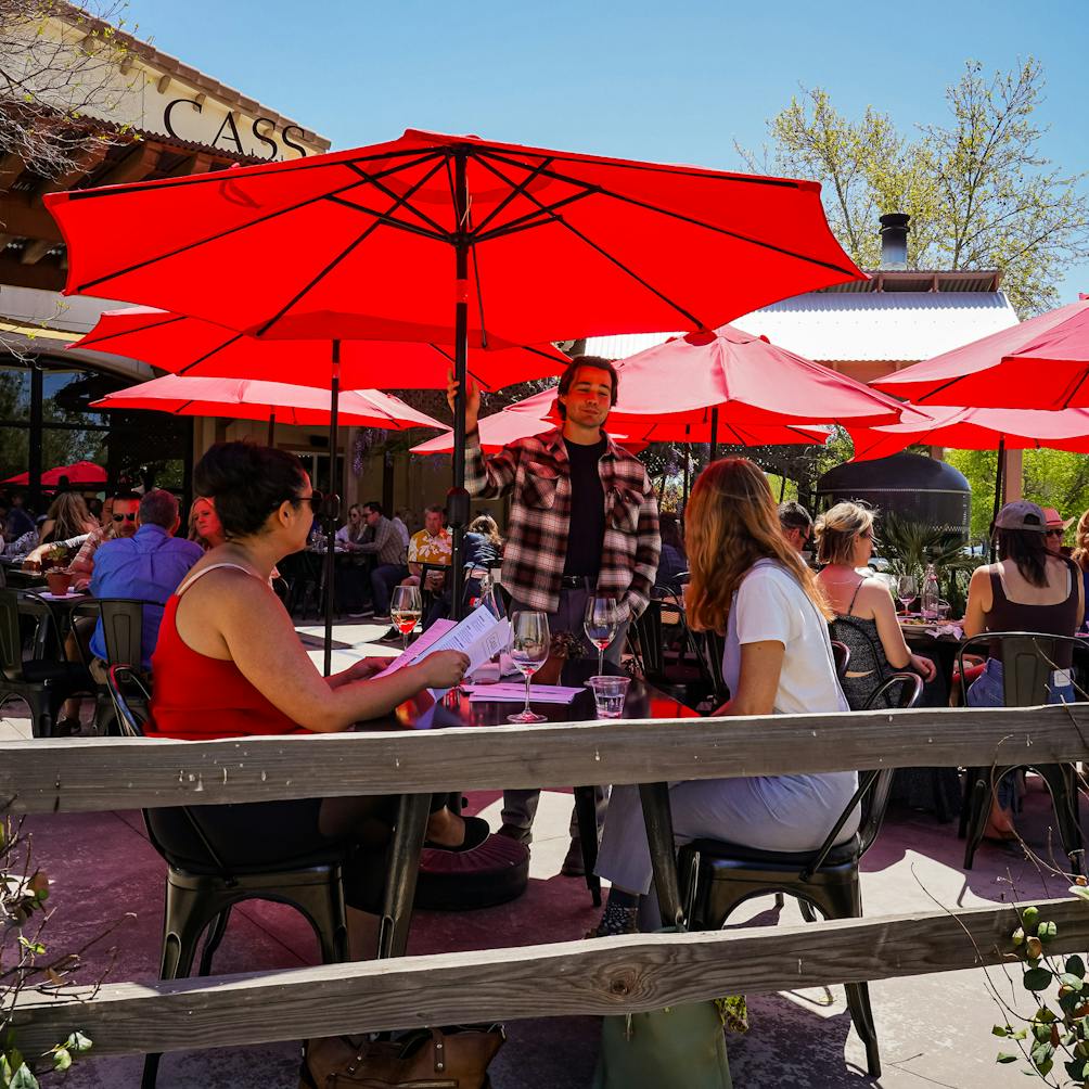 The lively outdoor patio filled with people at Cass Vineyard and Winery near Paso Robles 