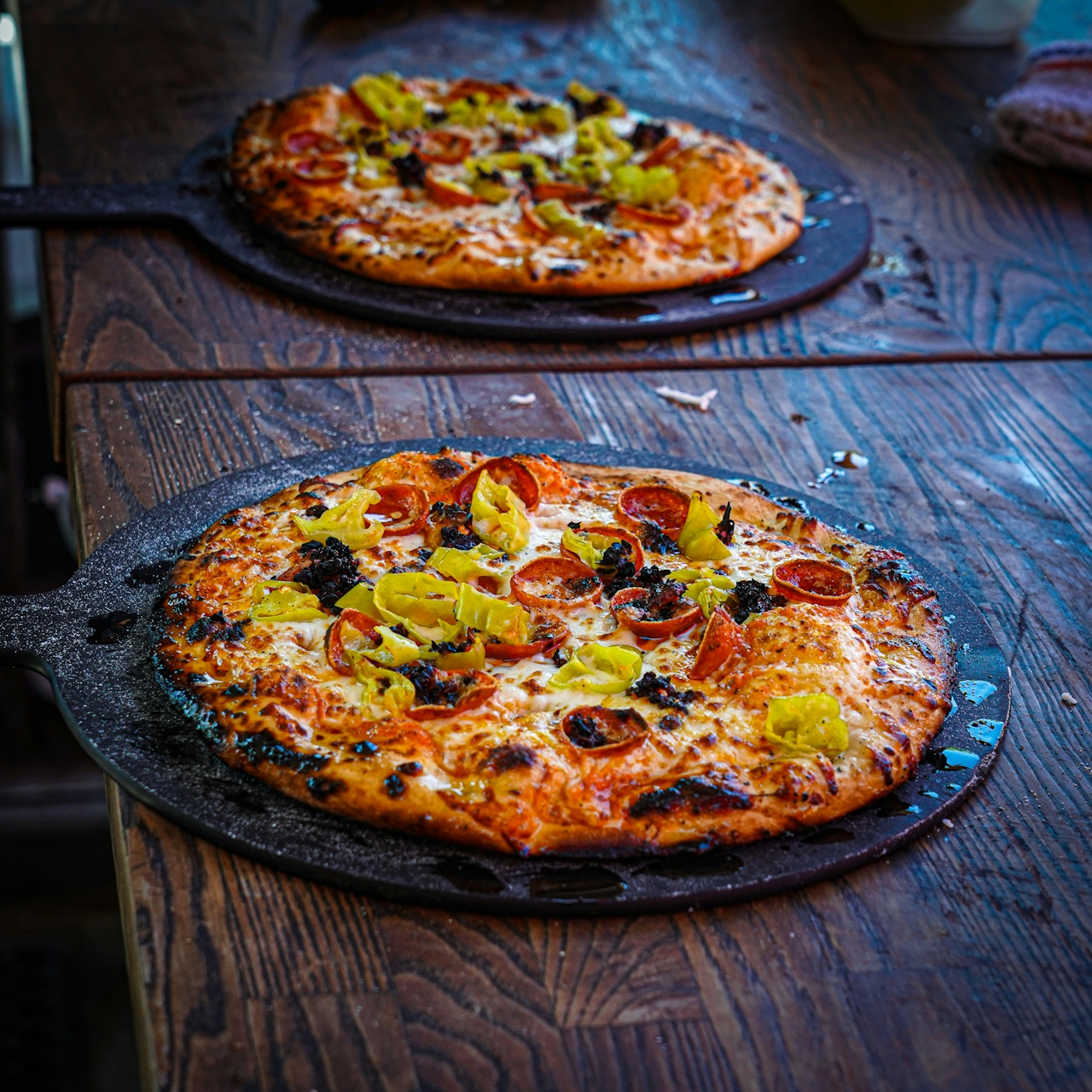 Two Woodfire pizzas on a table at Cass Vineyard and Winery near Paso Robles
