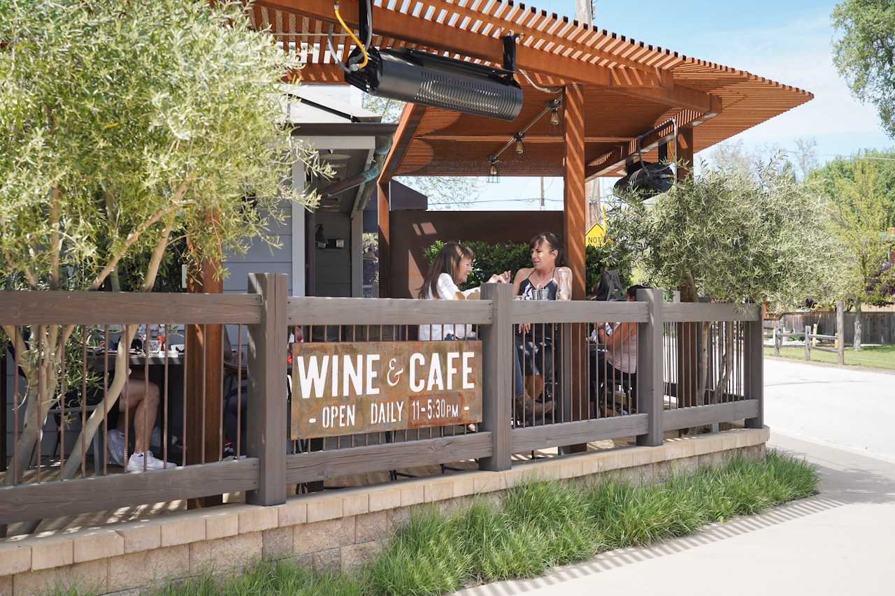 Ancient Peaks Winery front patio area with a sign reading Wine and Cafe