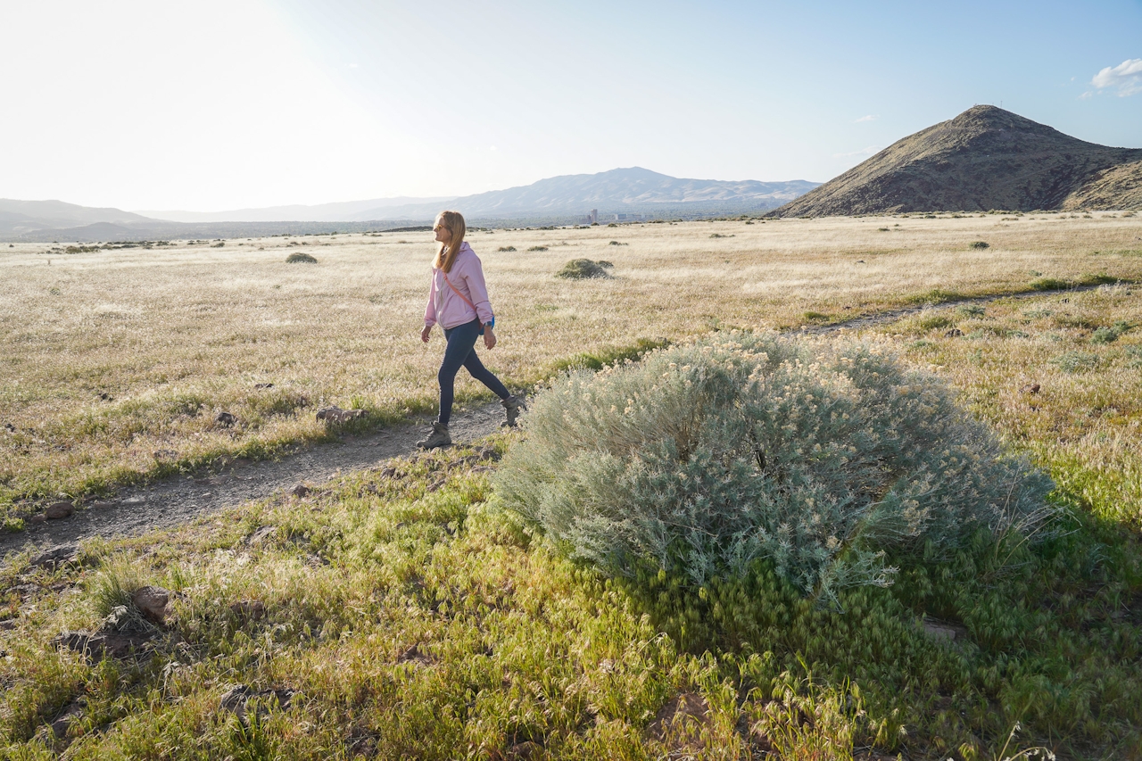 A woman walks a trail at Huffaker Hills Open Space in Reno 