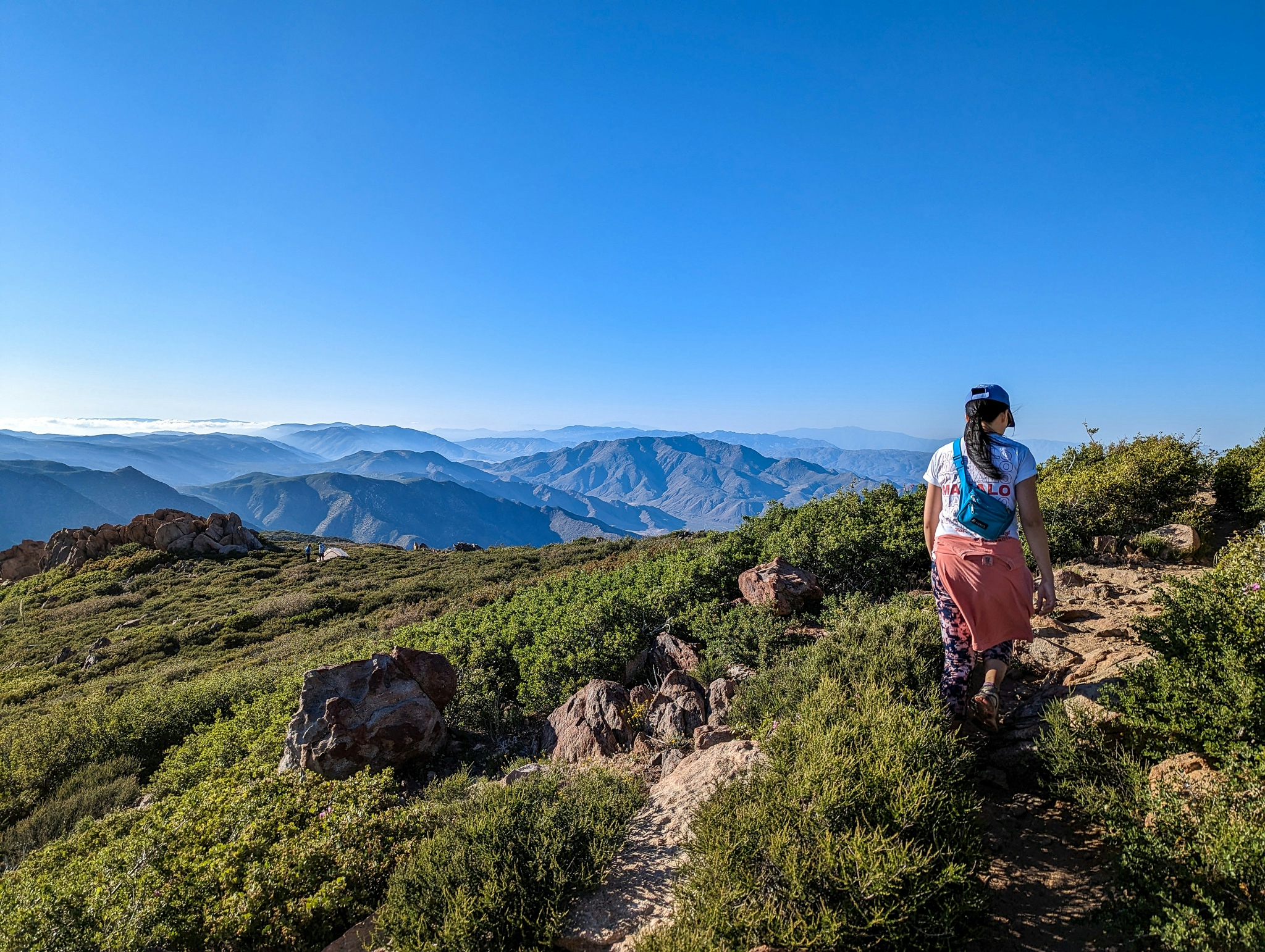 Woman standing at a high point on Garnet Peak in San Diego County